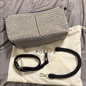 Rothy's black, white, and metallic gold “The Daily Crossbody”